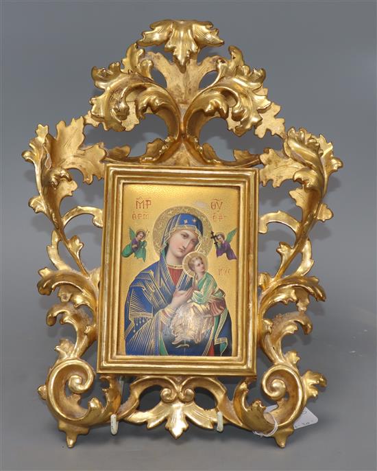 A Continental porcelain icon depicting Madonna and Child, in a Florentine frame